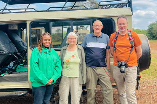 Tourists enjoying a Kenya safari with Afric Mzizi Safaris